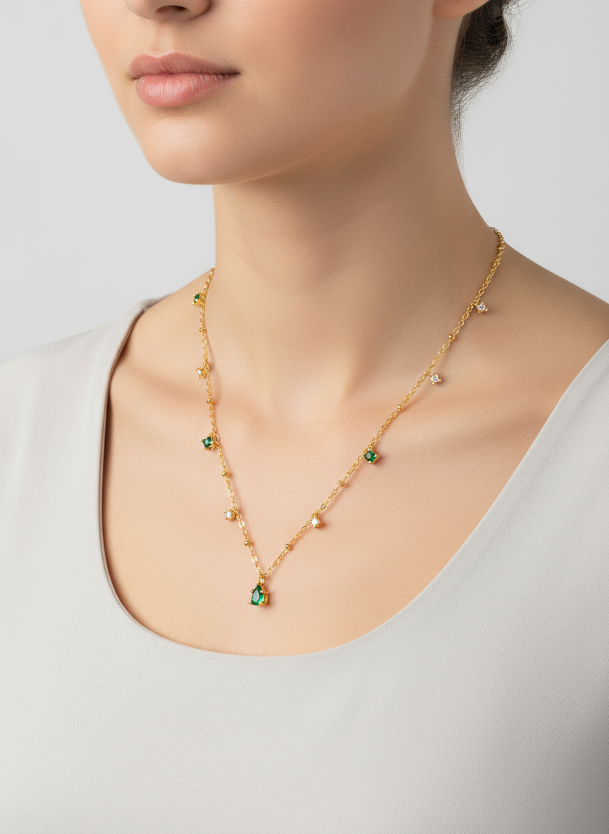 dainty gold plated silver station necklace with emerald green and cubic zirconia drops dainty gold plated silver station necklace with emerald green and cubic zirconia drops